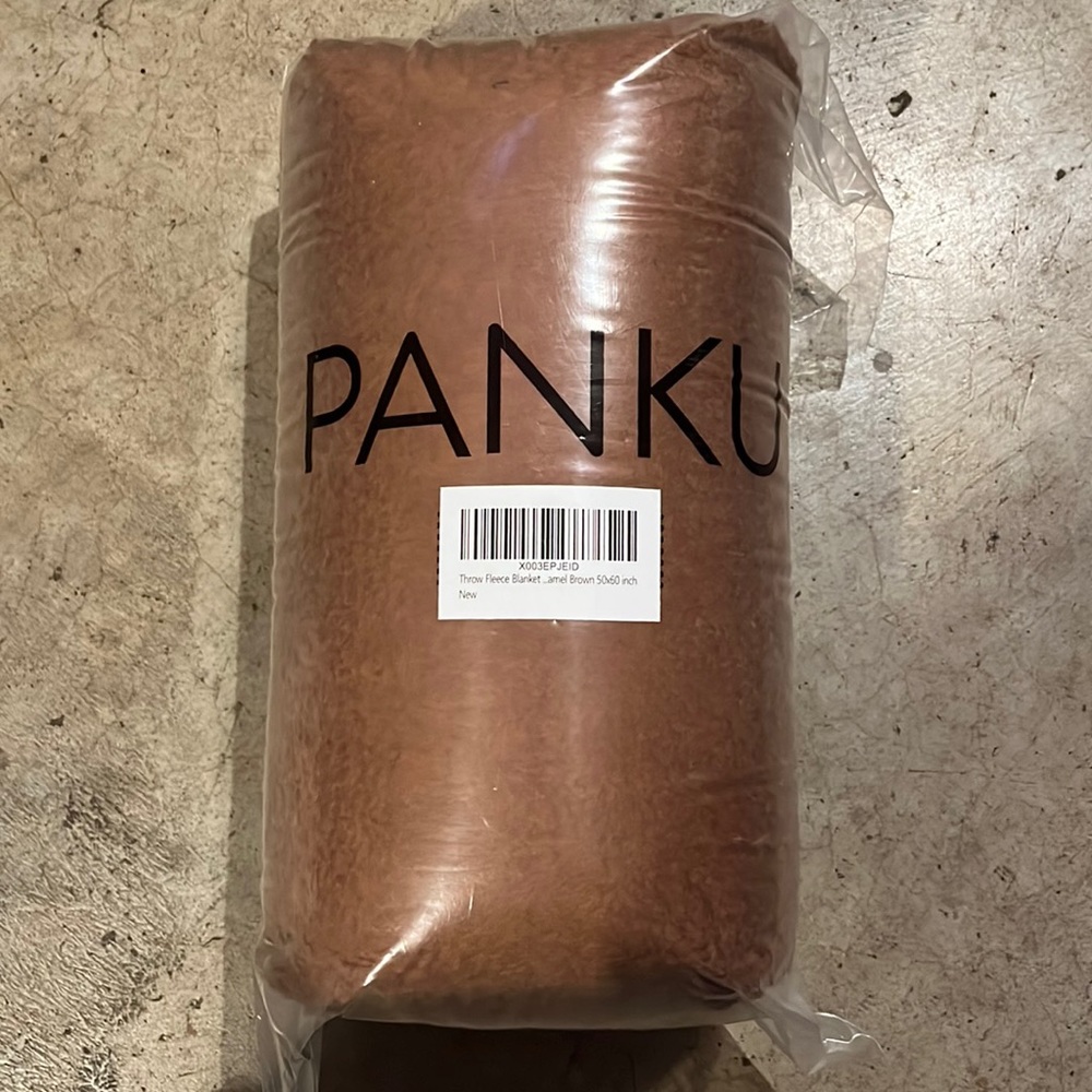 Carmel brown fleece throw blanket.sealed. Never opened